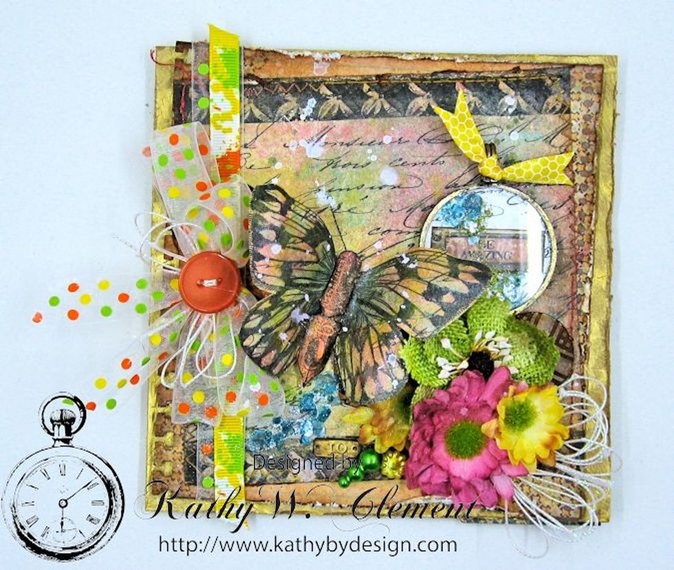 Add ribbon border on left hand side with Scor-Tape.  Top with Sheer Citrus Dots Bow, string bow and button. Fussy cut pen nib, color ad add as body on butterfly. Spatter white paint if desired.