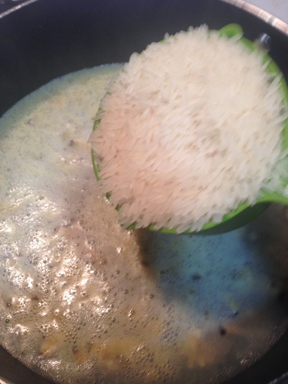 Add rice in it and cook for 45-60 min in medium heat. Keep stirring to make sure the rice not burn at the bottom.