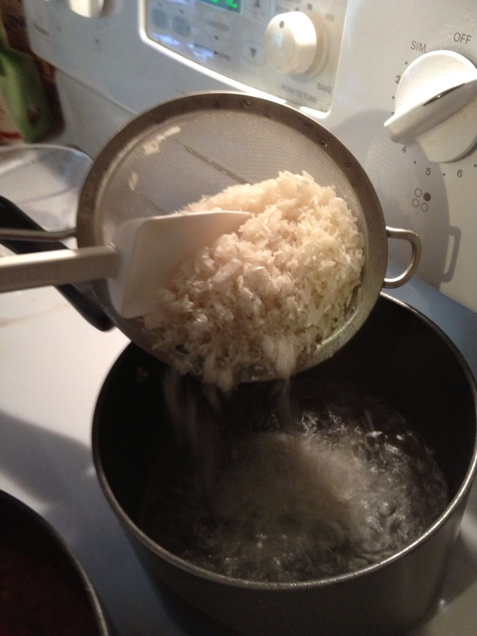 Add rice to boiling water, cover and reduce heat to a simmer. Simmer for 15 minutes. Resist the urge to lift the lid and check the rice during the 15 minutes. It will affect the texture of the rice.