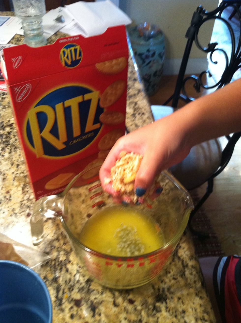 Add ritz crackers to the melted butter and poppy seeds (1 1/2 sticks of ritz crackers)
