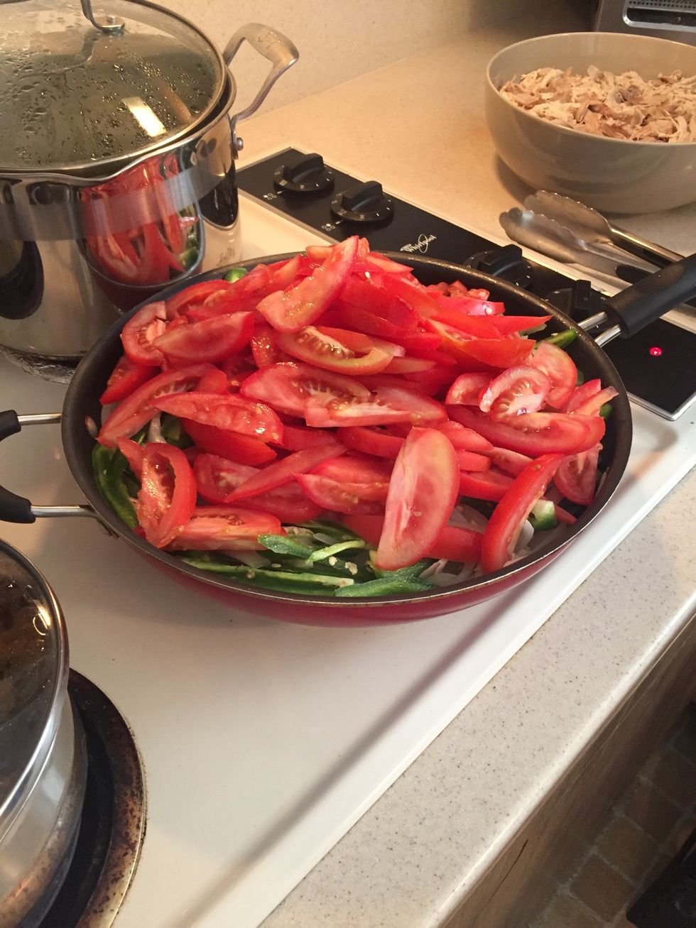 Add Roma tomatoes and continue cooking for 2-3 minutes