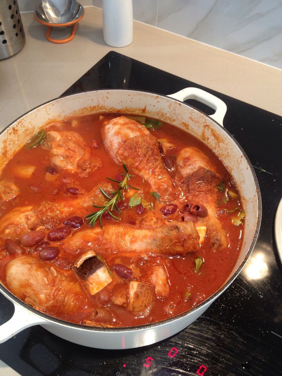 Add rosemary, mushrooms, celery, olives, leek, stock and pasta sauce. Add sugar and salt. Simmer for 10 mins on low heat. Place pot with lid on in oven for 30 mins at 180 degrees C.
