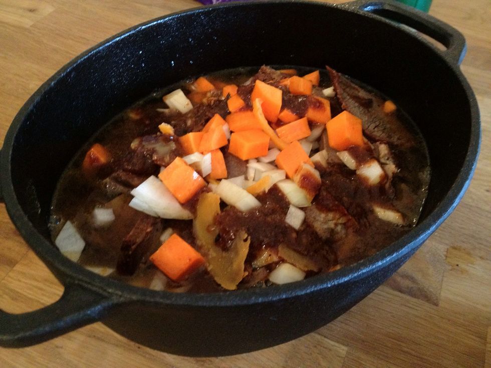 Add salt and pepper, the gravy, wine and water