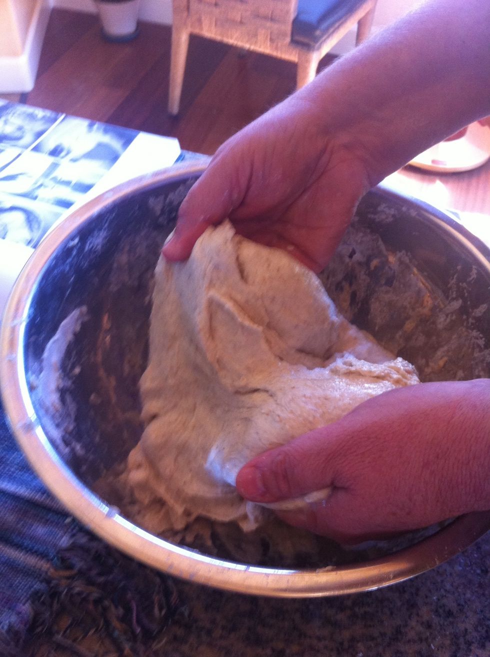 Add salt and water to dough and mix in by hand.