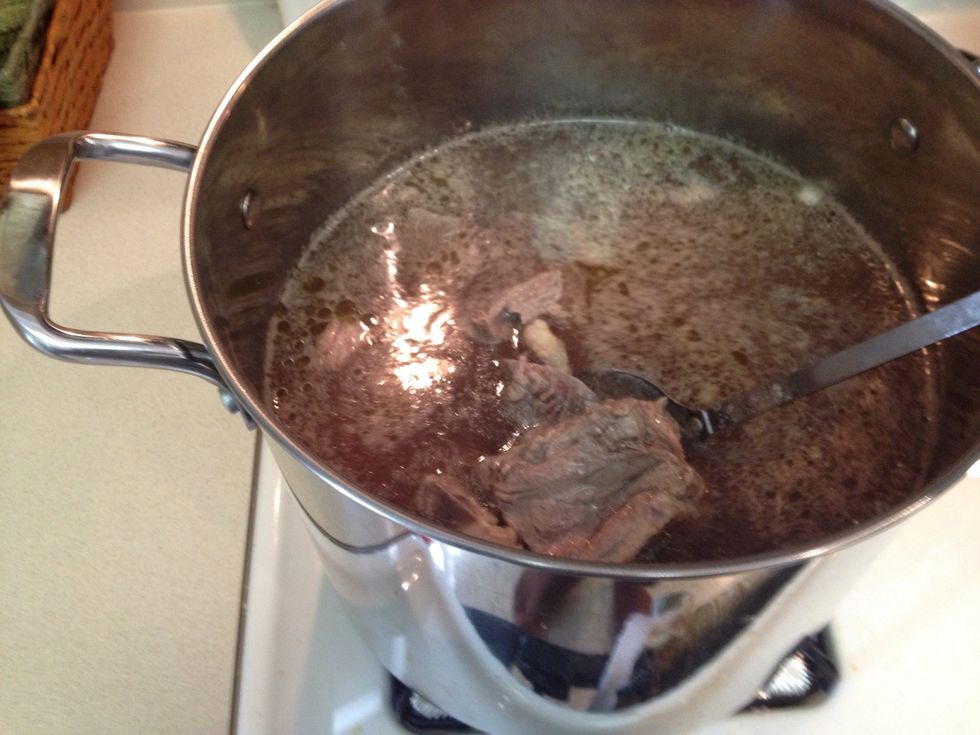 Add salt garlic cloves and beef bouillon and cover to a medium boil for 50 min