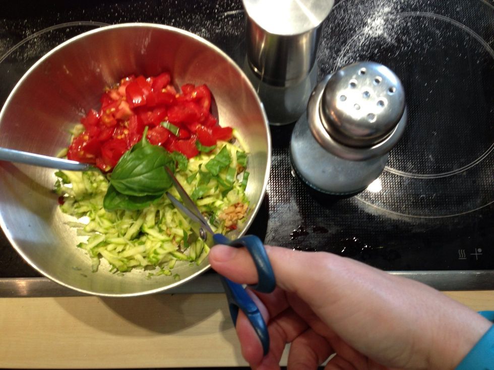 Add salt, pepper and cut basil leaves.
