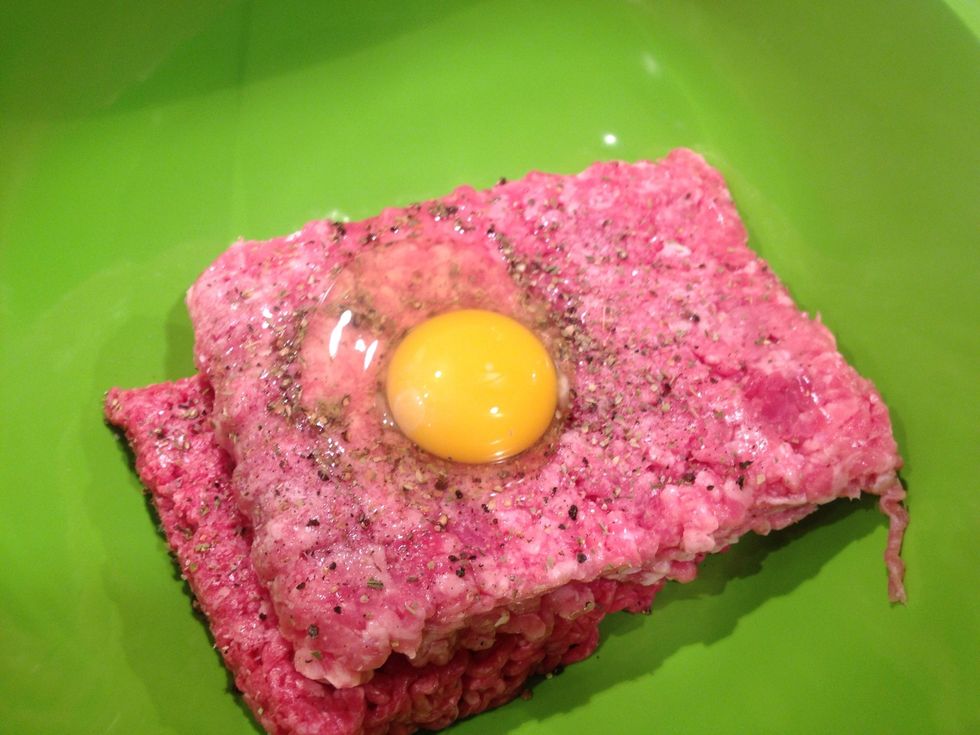 Add salt, pepper, dried oregano, and egg.