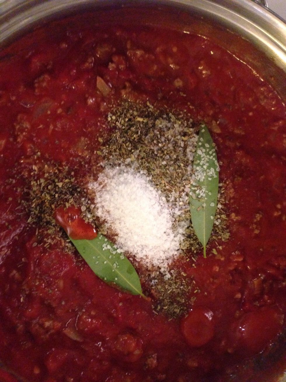 Add salt seasoning and bay leaves (DO NOT add the Basil yet) Cook on low to Medium for at least an hour. I cooked mine for 2 and a half.