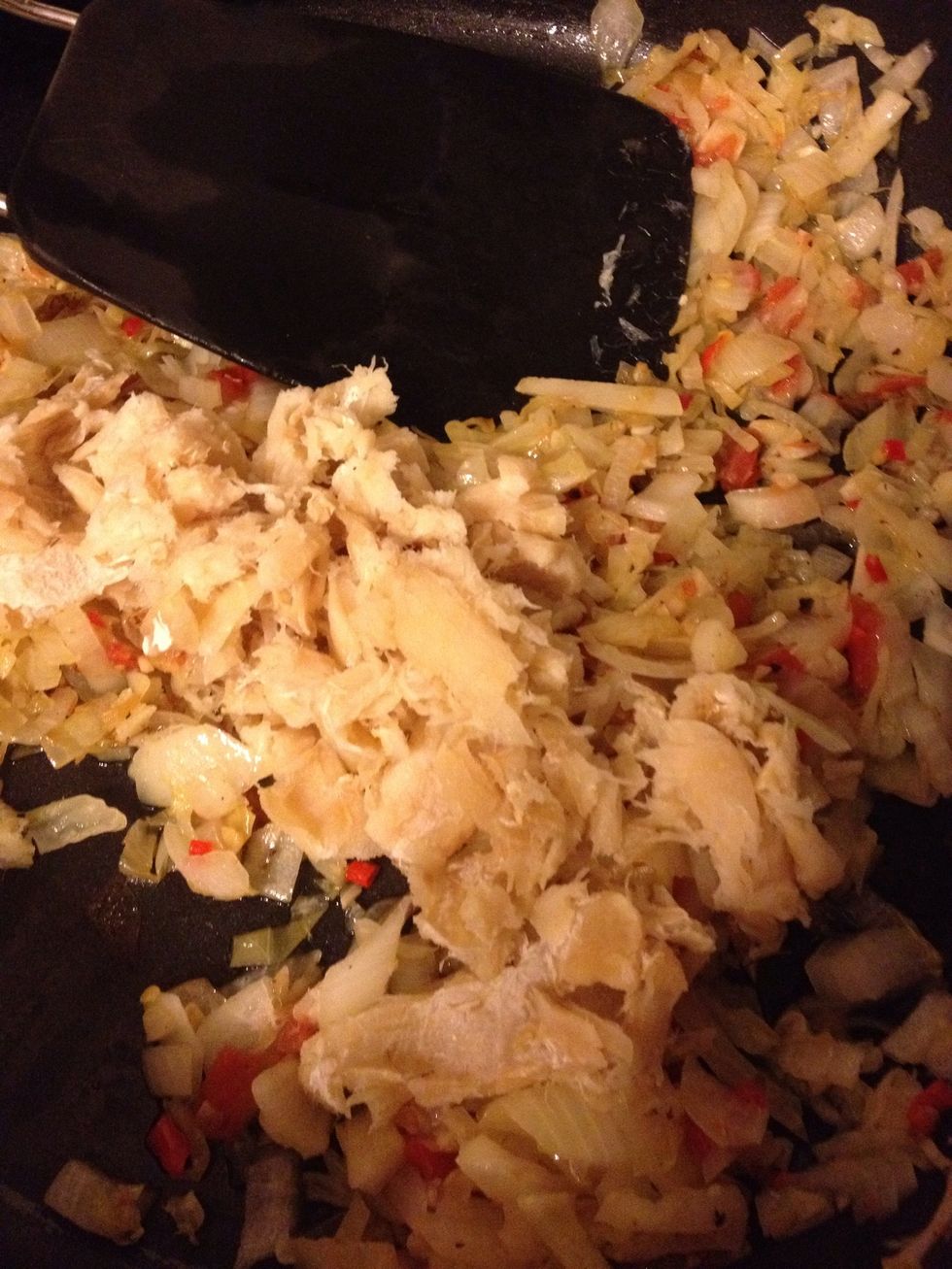 Add Saltfish... Stir well. Cook for another 10 minutes or so.