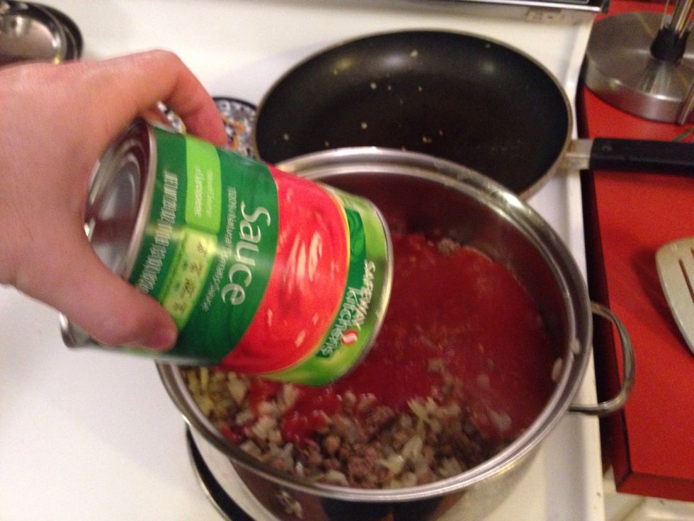 Add sauce, paste and diced tomatoes.