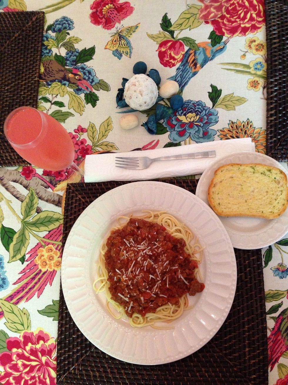 Add sauce to pasta with garlic bread and I added Parmesan cheese for decoration , with a glass of watermelon punch yumm