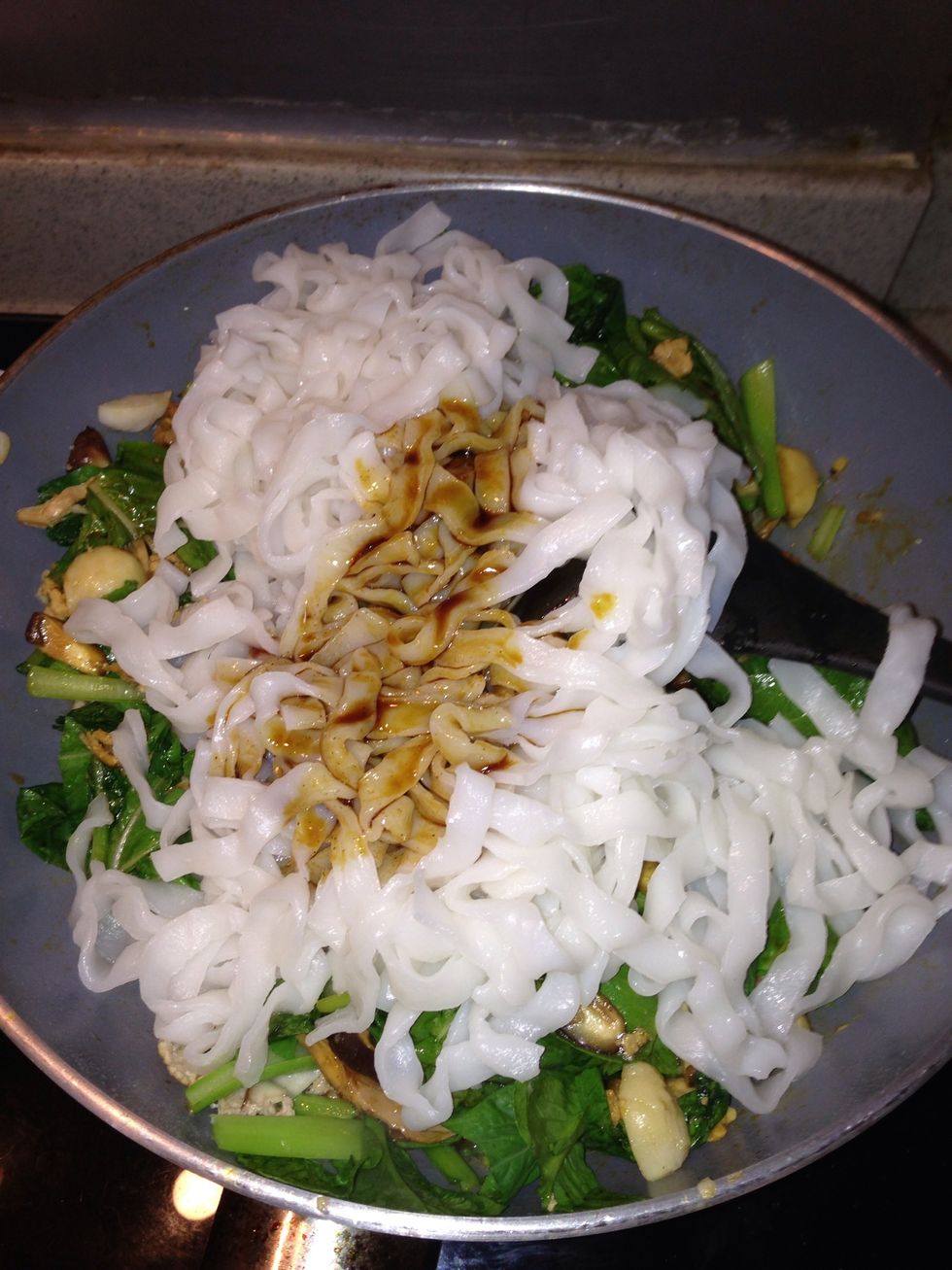Add sauce to the wok and stir vigorously to blend well.