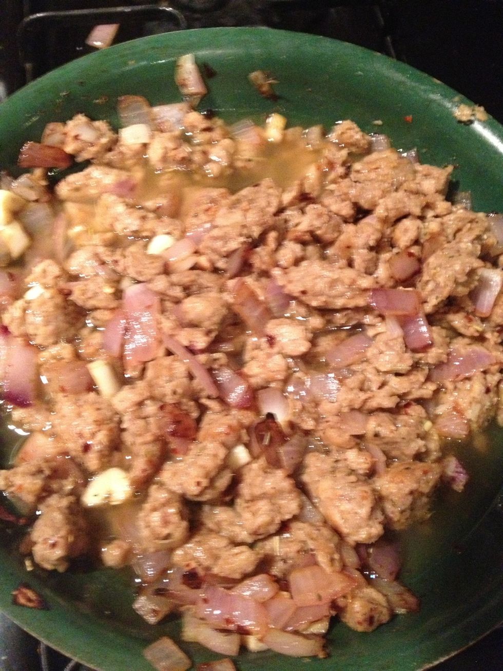 Add sausage. Break sausage into small pieces. If the onions or sausage begin to stick to the pan, add a little broth to the pan. Cook together for about 2 minutes.