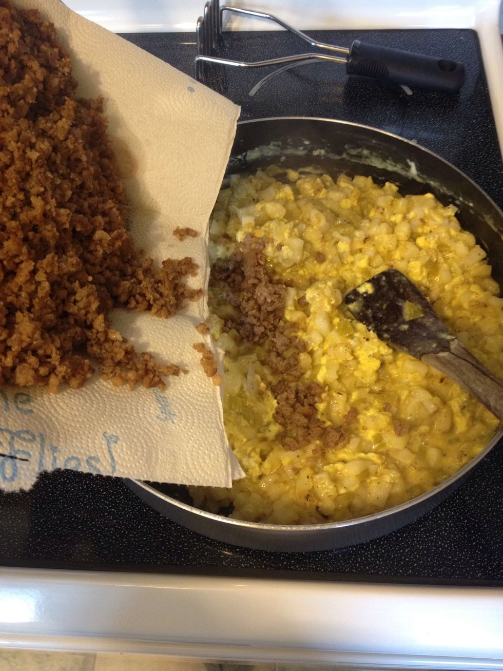 Add sausage into mixture when eggs had set up some.