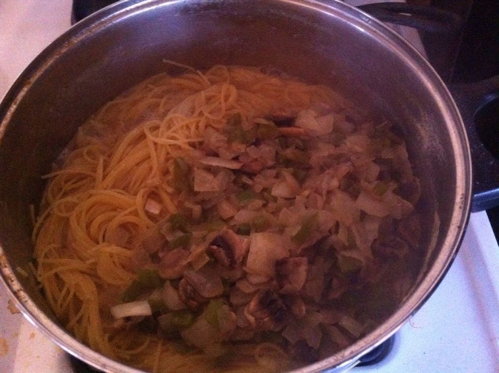 Add saut\u00e9ed veggies to the noodle pot
