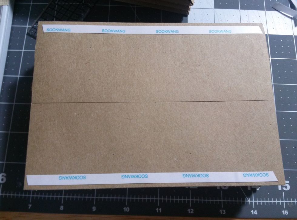 Add Scor-Tape to the top and bottom of each envelope to create an accordian for inside the box.