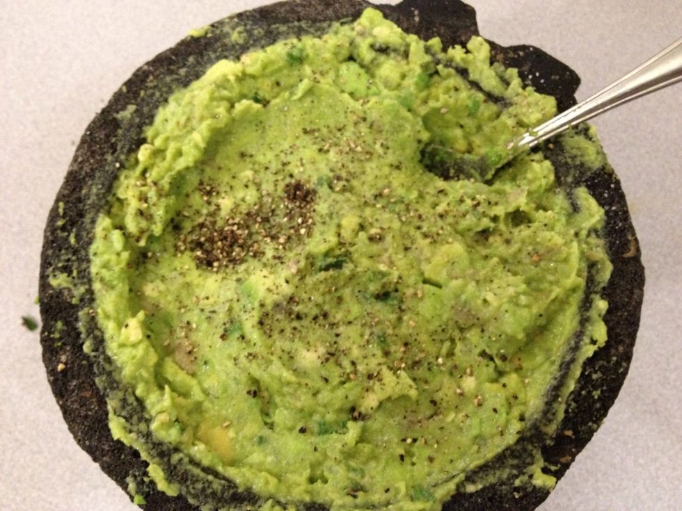 Add sea salt and pepper to the avocado mixture.