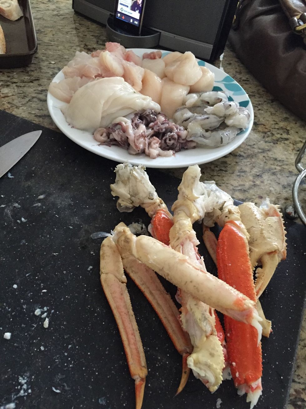 Add seafood and cover with sauce, do not stir and let simmer for 5-10 minutes then serve