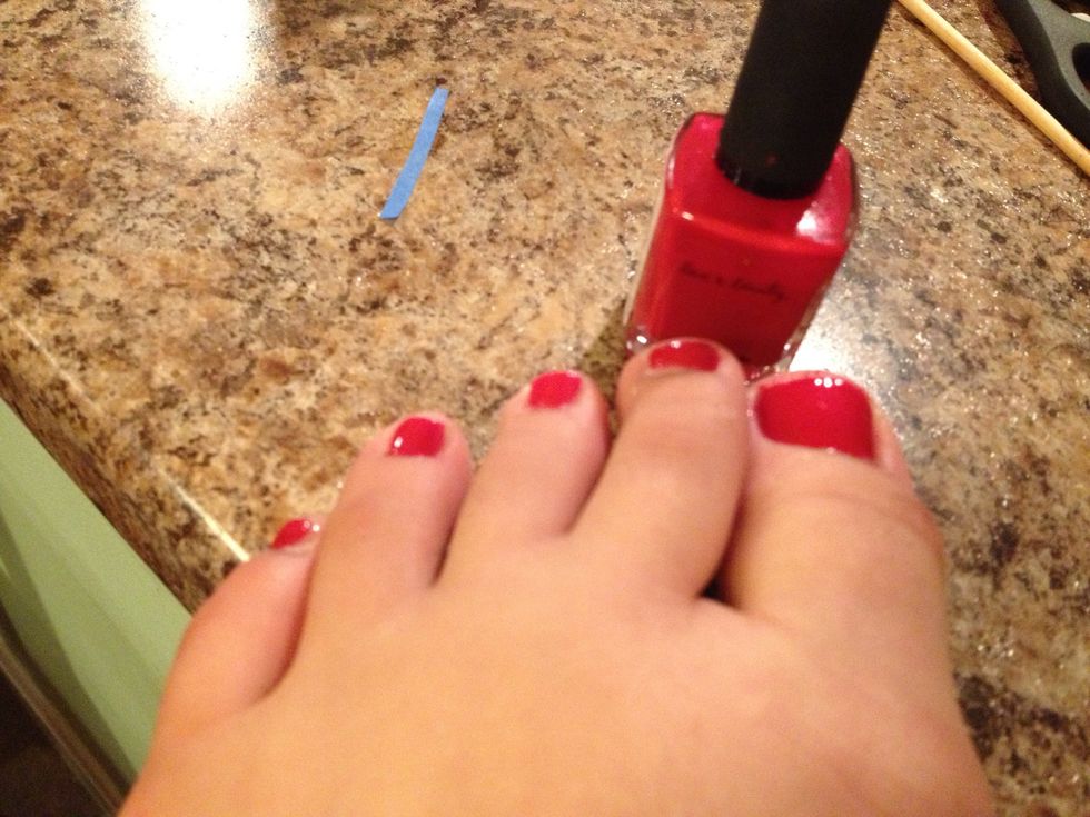 Add second layer of red polish.