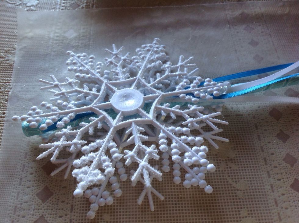 Add second snowflake on top of dowel and ribbon, lining up straight.
