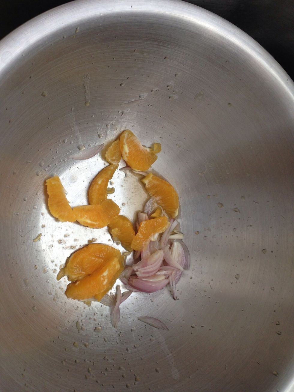 Add segments to Shallot. Squeeze juice out of remaining orange pulp.