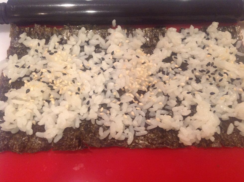 Add sesame seeds by sprinkling them across rice