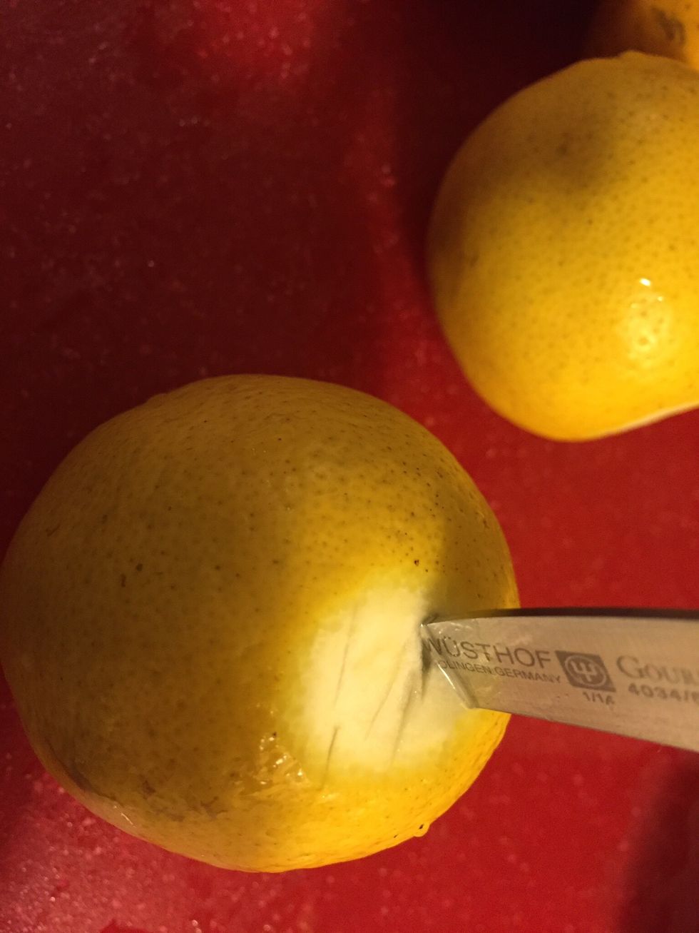 Add several cuts to back of lemons to maximize extraction.