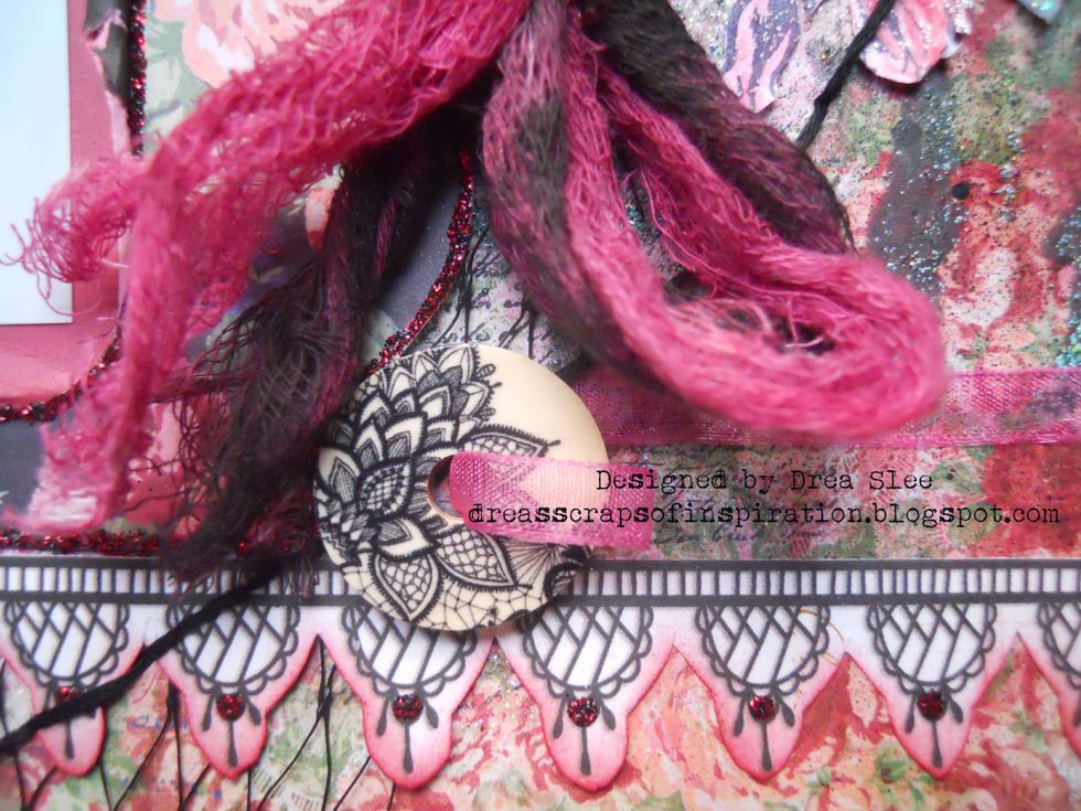 Add sheer ribbon from the Ephemera to the wood buttons, making a bow to the one on the left, and a loop from the one on the right.