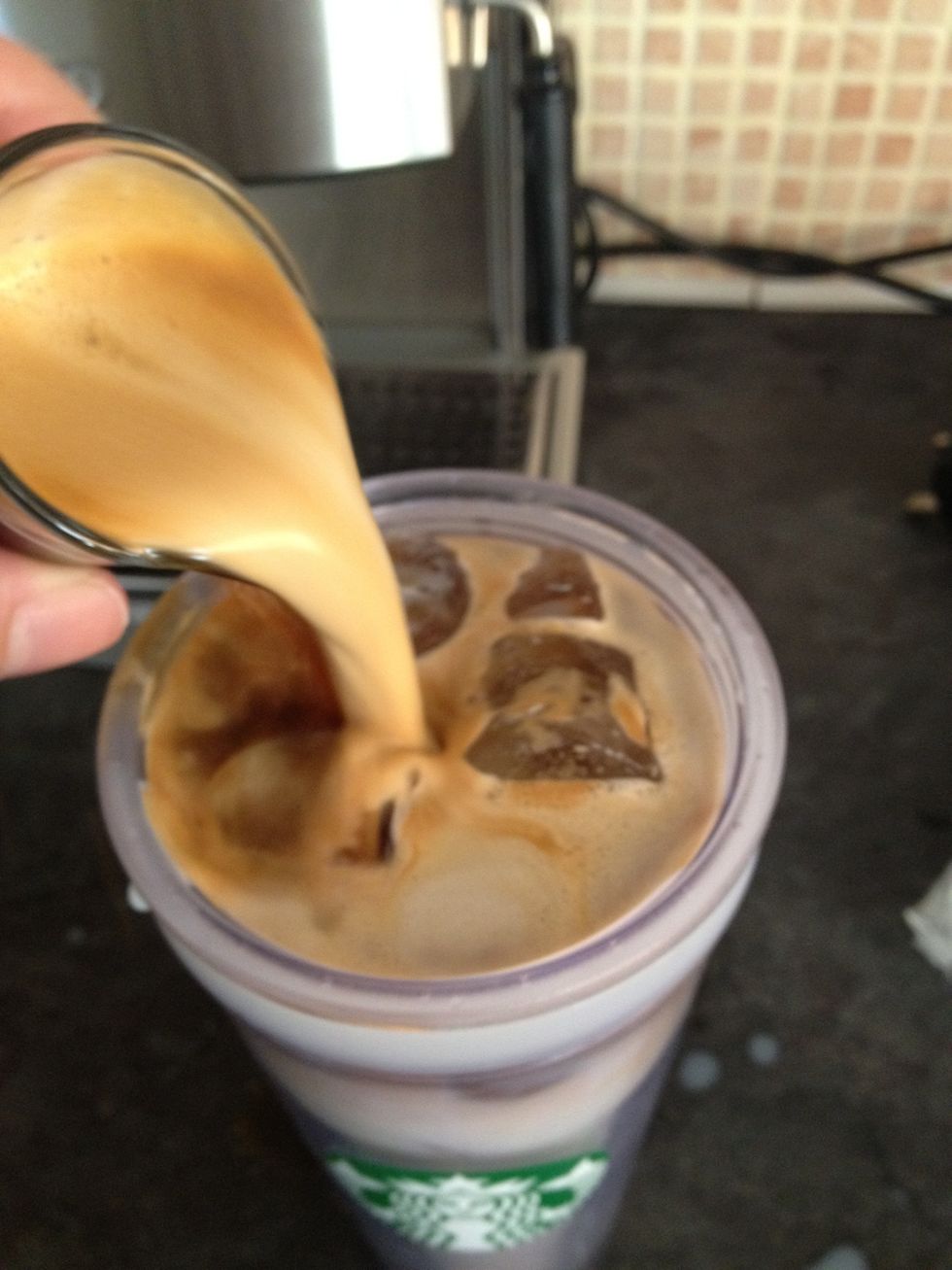 Add shots to milk. You can add this on top to create a nice effect (macchiato), or you can add the shots BEFORE the milk too.