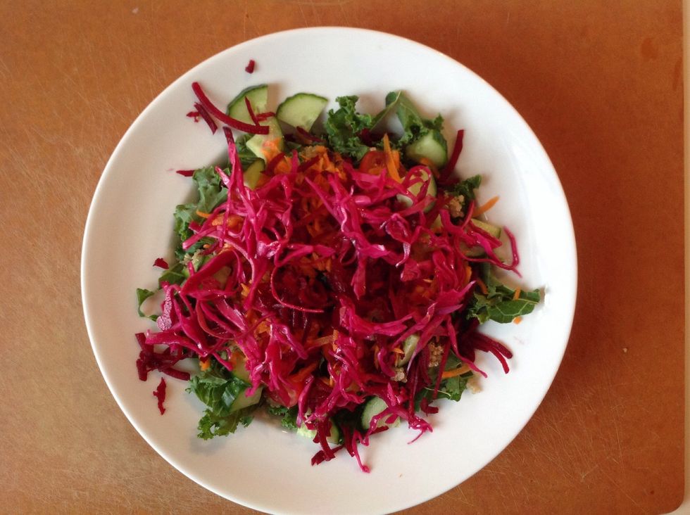 Add shredded carrots, shredded beets, and the pickled cabbage. It is well worth making the pickled cabbage - it keeps to give salads a boost all week long!