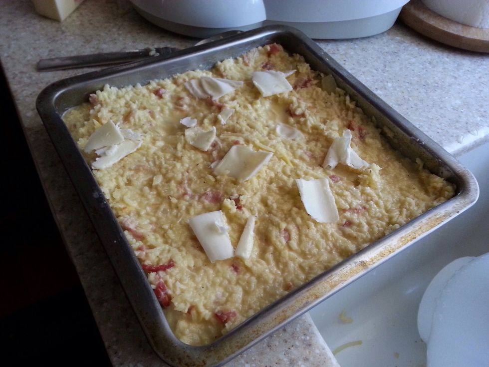 Add shredded/shaved butter to top to brown.