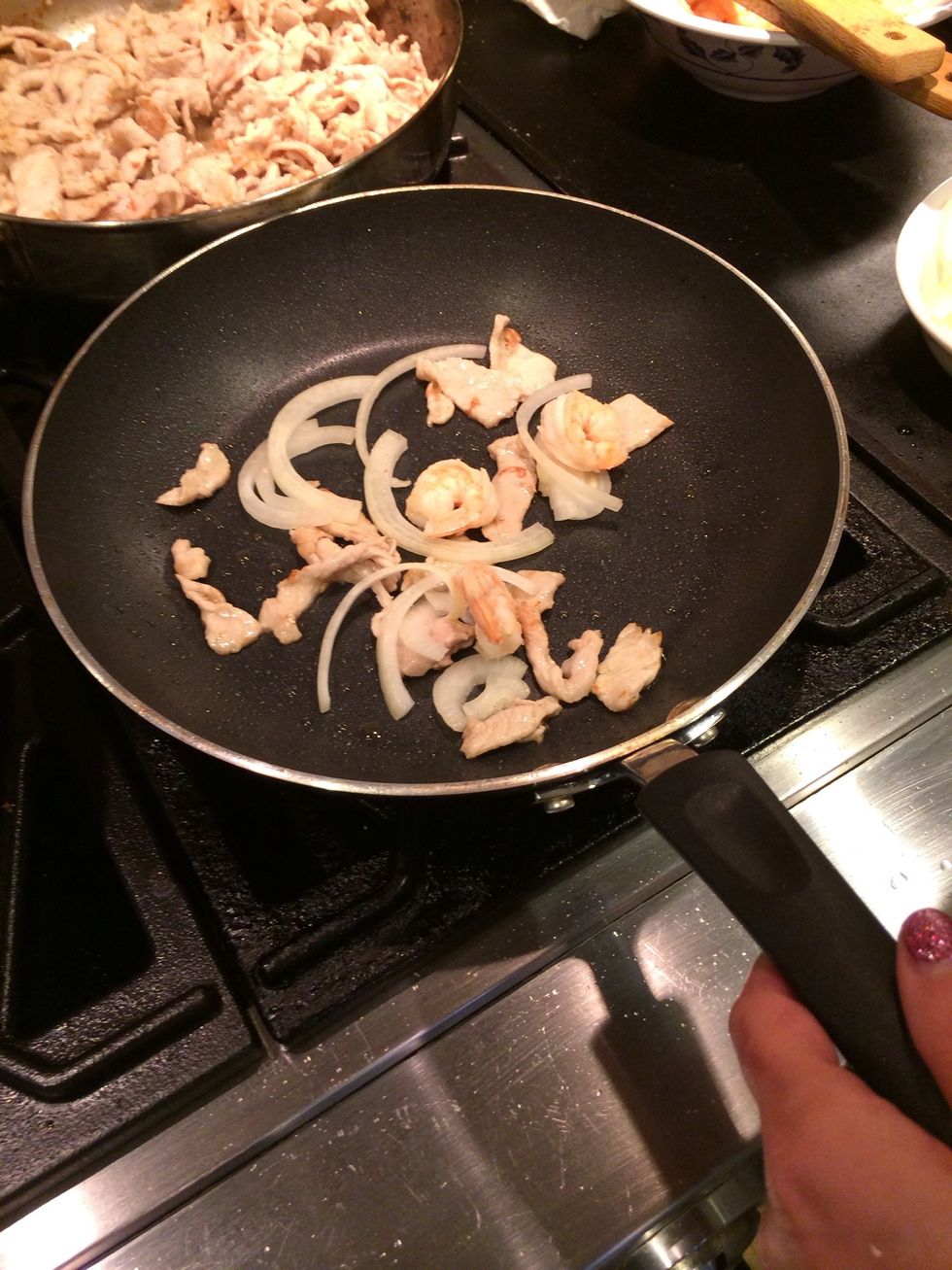 Add shrimp and onions.