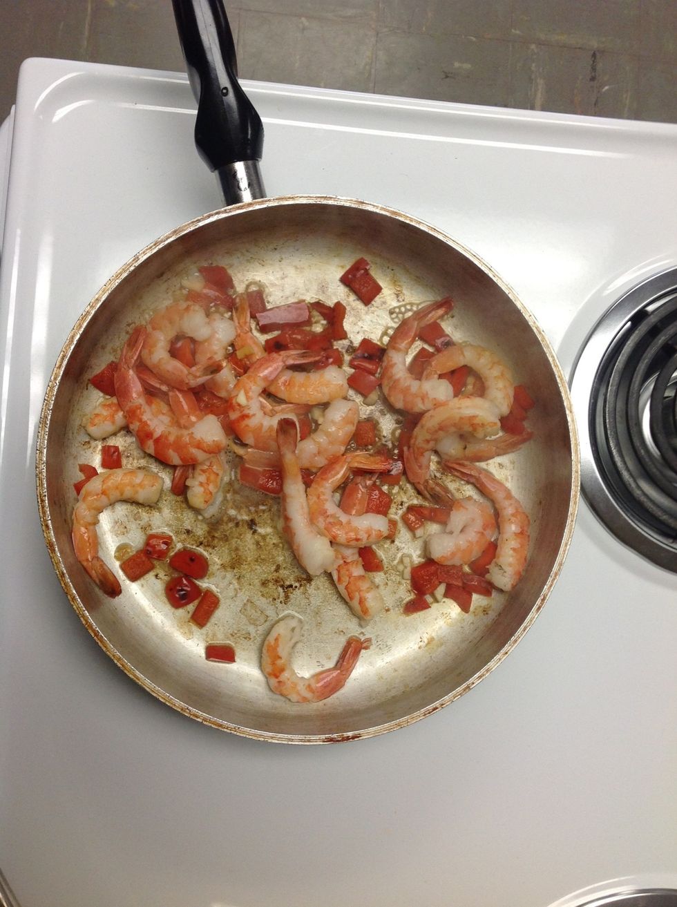 Add shrimp, garlic, and lemon juice; cook and stir 2 mins (remove shrimp tails before hand)