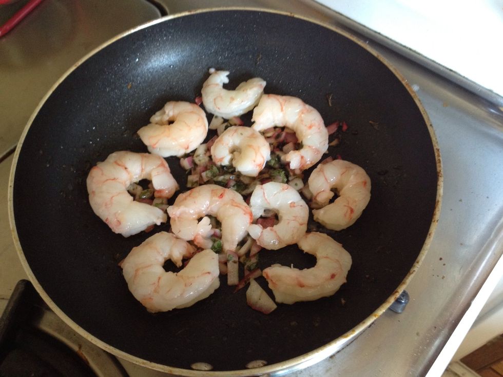 Add shrimp! Make sure to get the skin of the shrimp directly on the pan