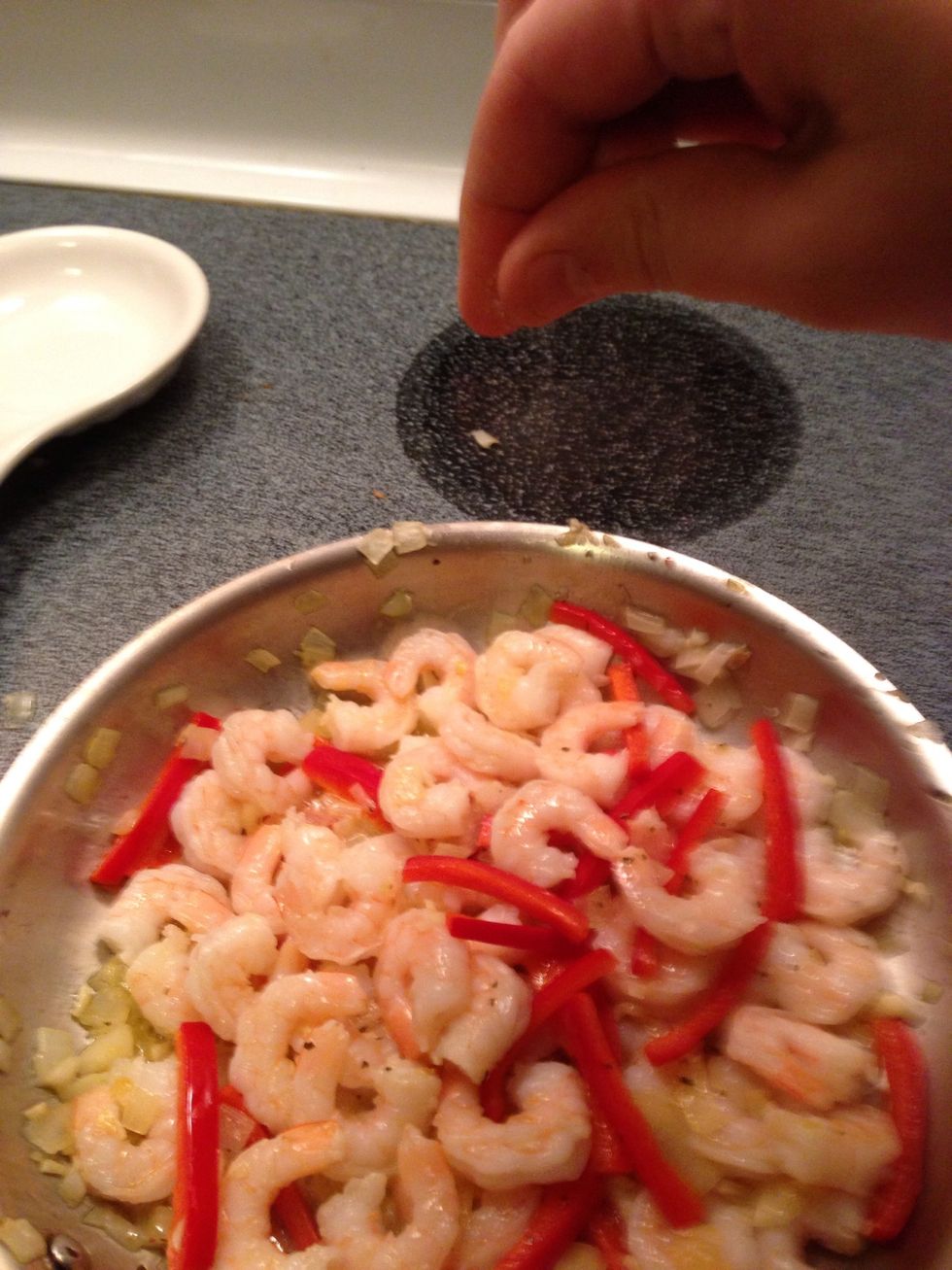 Add shrimp then season with salt