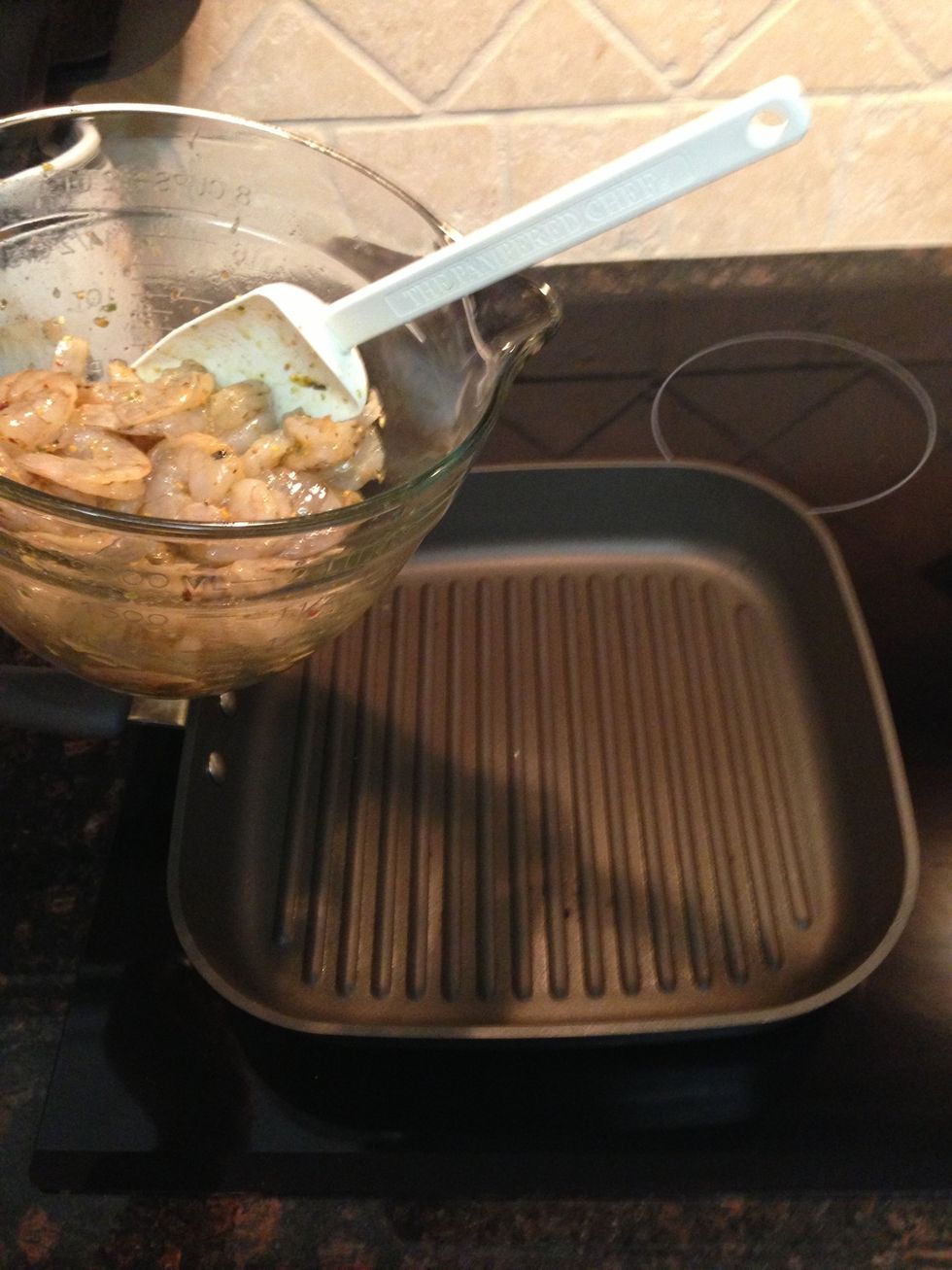 Add shrimp to pan. No need add non stick spray or oil, as the grill pan is non stick & the shrimp are coated with olive oil.