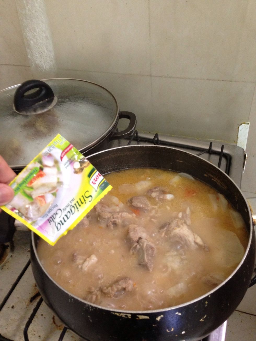 Add sinigang mix and gabi. Simmer for 30 to 40 minutes.