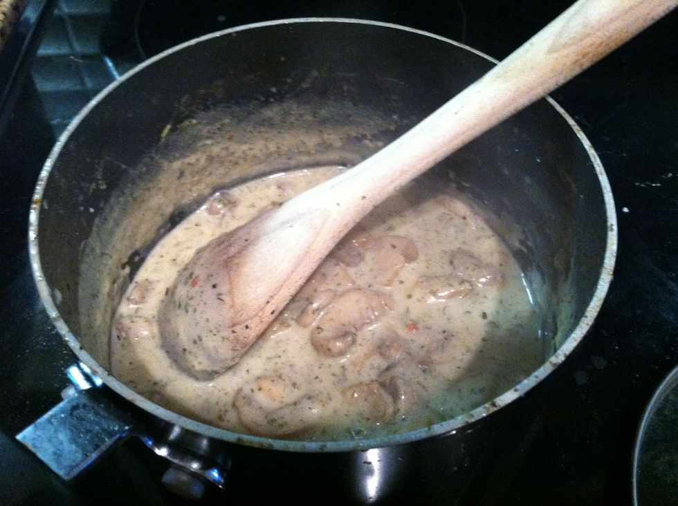 Add sliced mushrooms, white wine, strain all lobster stock into the roux. Stir til consistent. Add a mixture of warm stock and blended corn starch if a thickening agent is needed. Add salt to taste