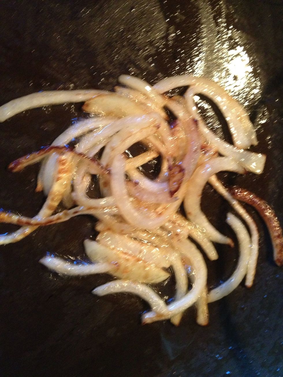 Add sliced onion to skillet and saut\u00e9 until nearly golden. I like mine a little crispy.