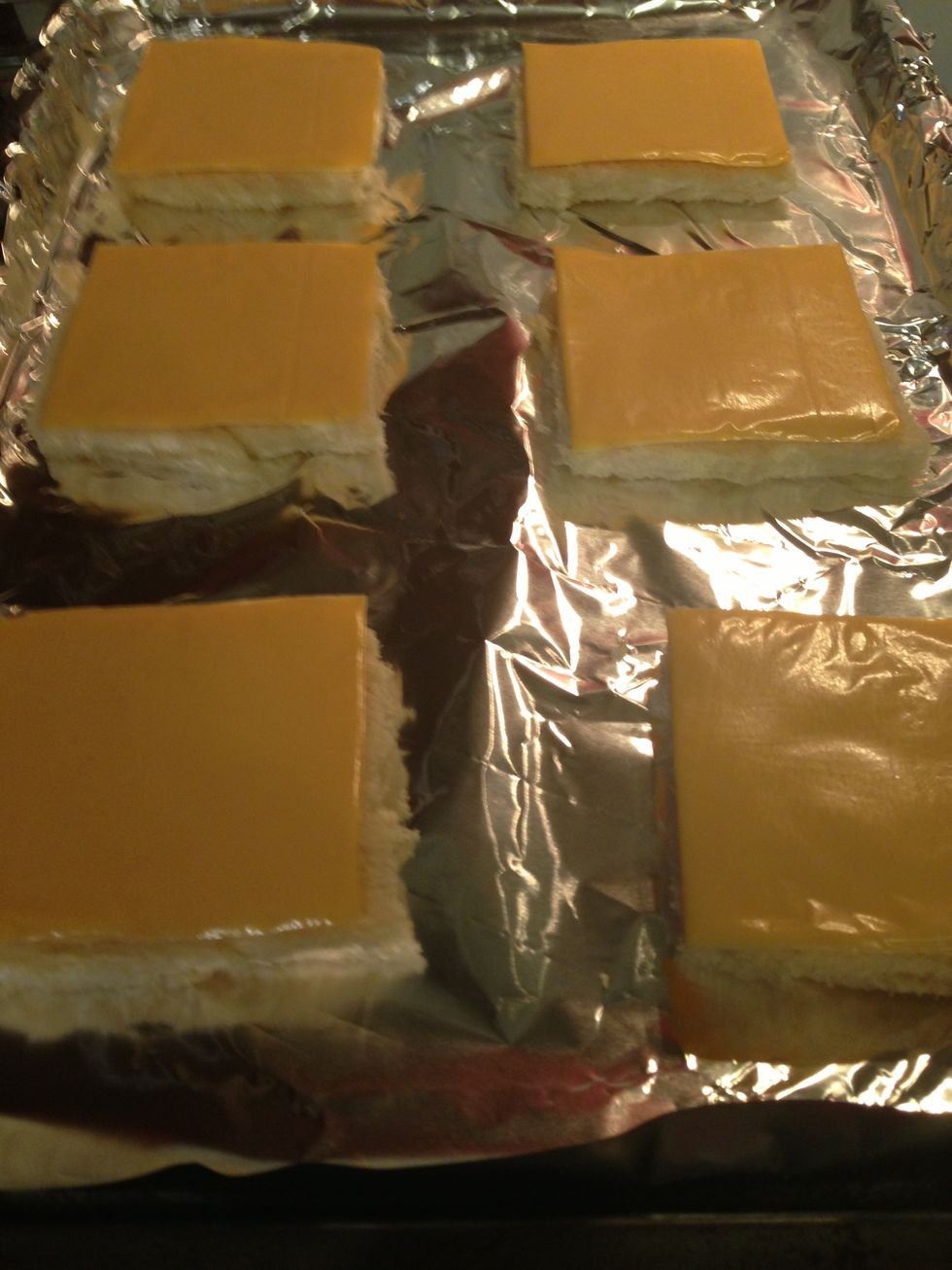 Add slices of cheese on top of each piece of bread.