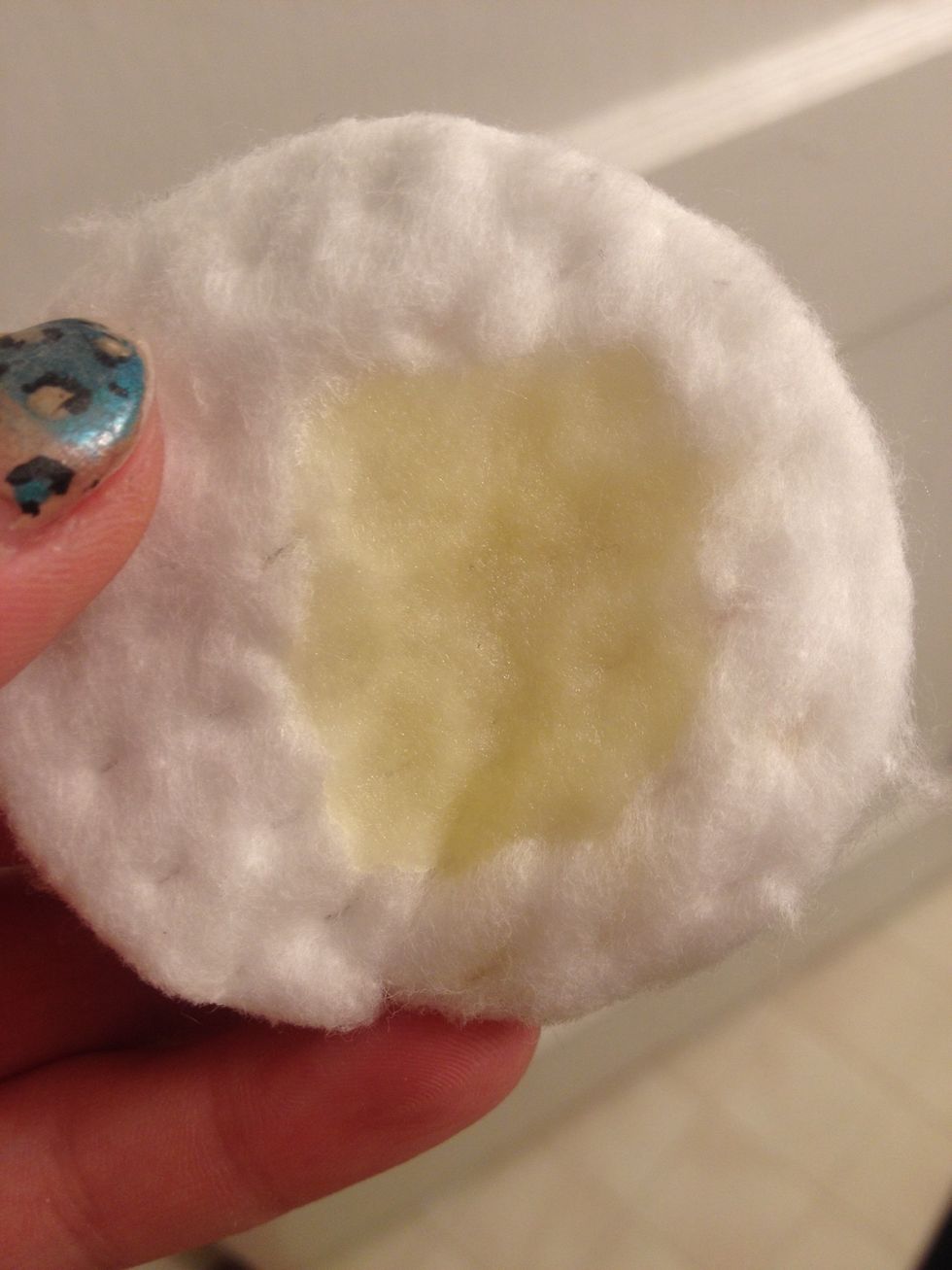 Add small amount of remover to a cotton pad.