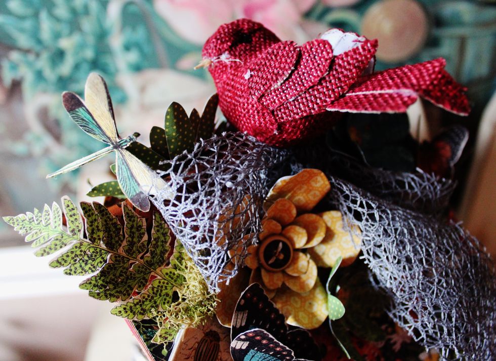 Add small burlap bird to top of birdhouse.