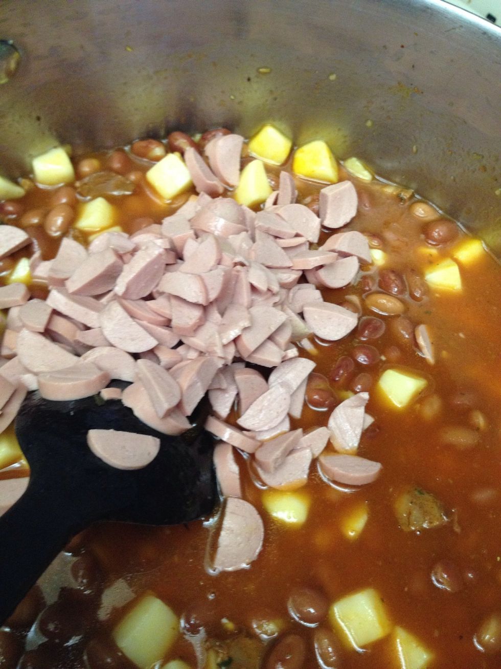 Add small cut Vienna sausages. (Optional) This is also the time you would chop and add olives. I love them but my family doesn't so I leave it out.