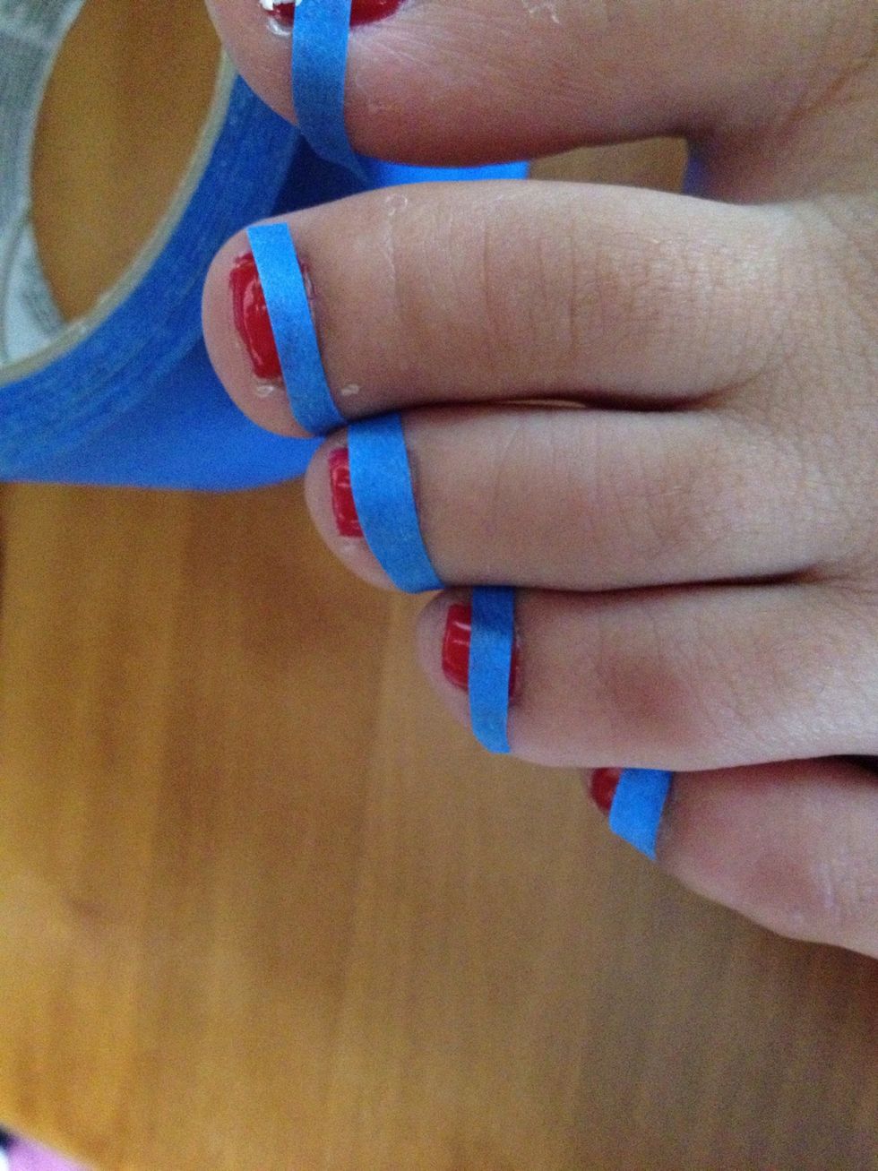 Add small strips of tape when your nails at FULLY dry. If they are not dry, the tape will take off the nail polish.