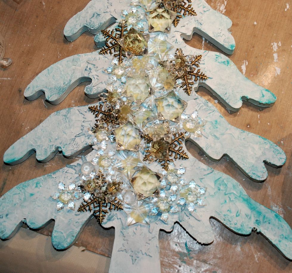 Add smaller embellishments with glue/medium.