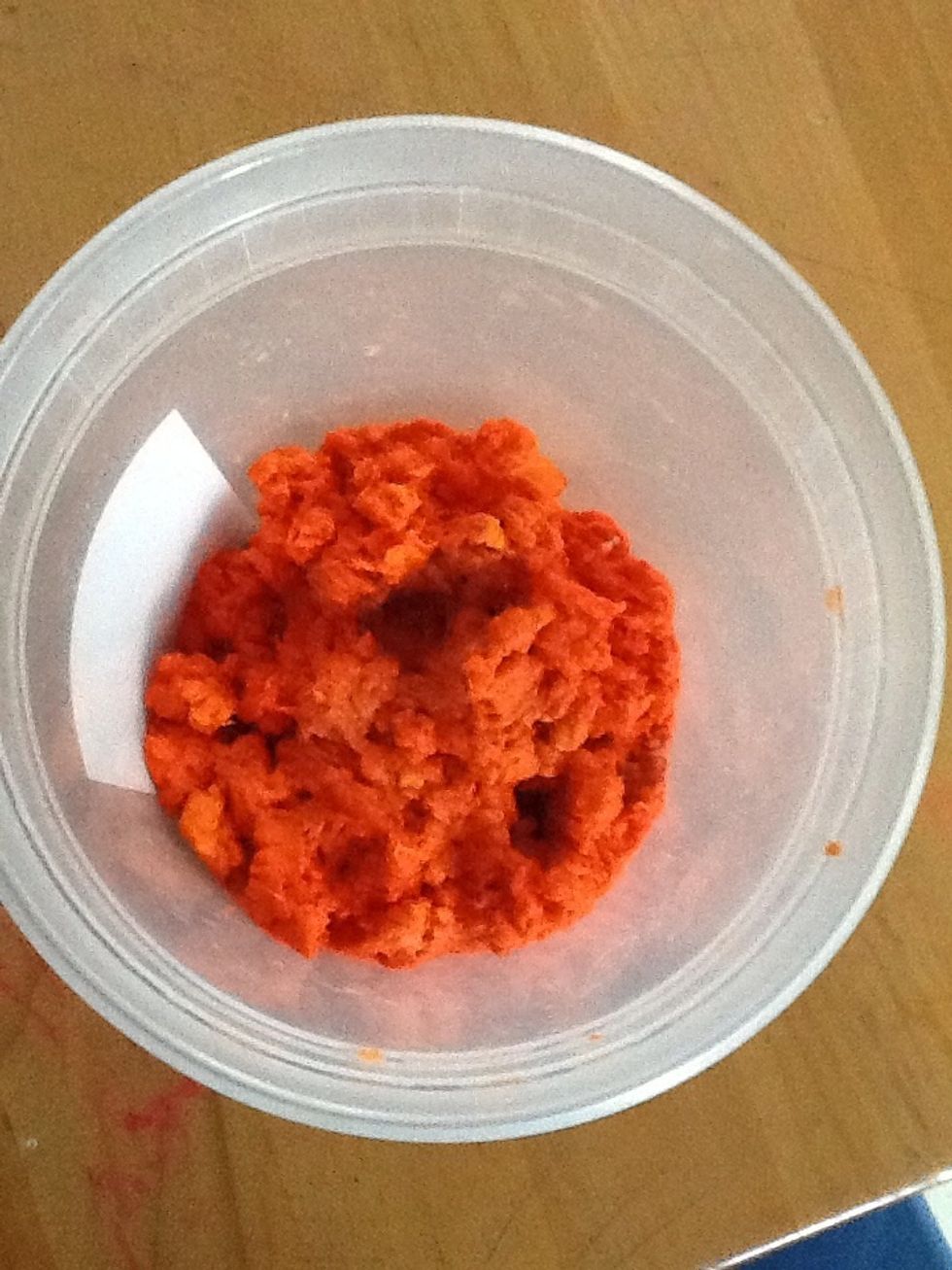 Add soaked paper to a blender. Blend on high speed, occasionally stirring (once the blender stops) with the handle of a wooden spoon. The pur\u00e9ed pulp will look like this.