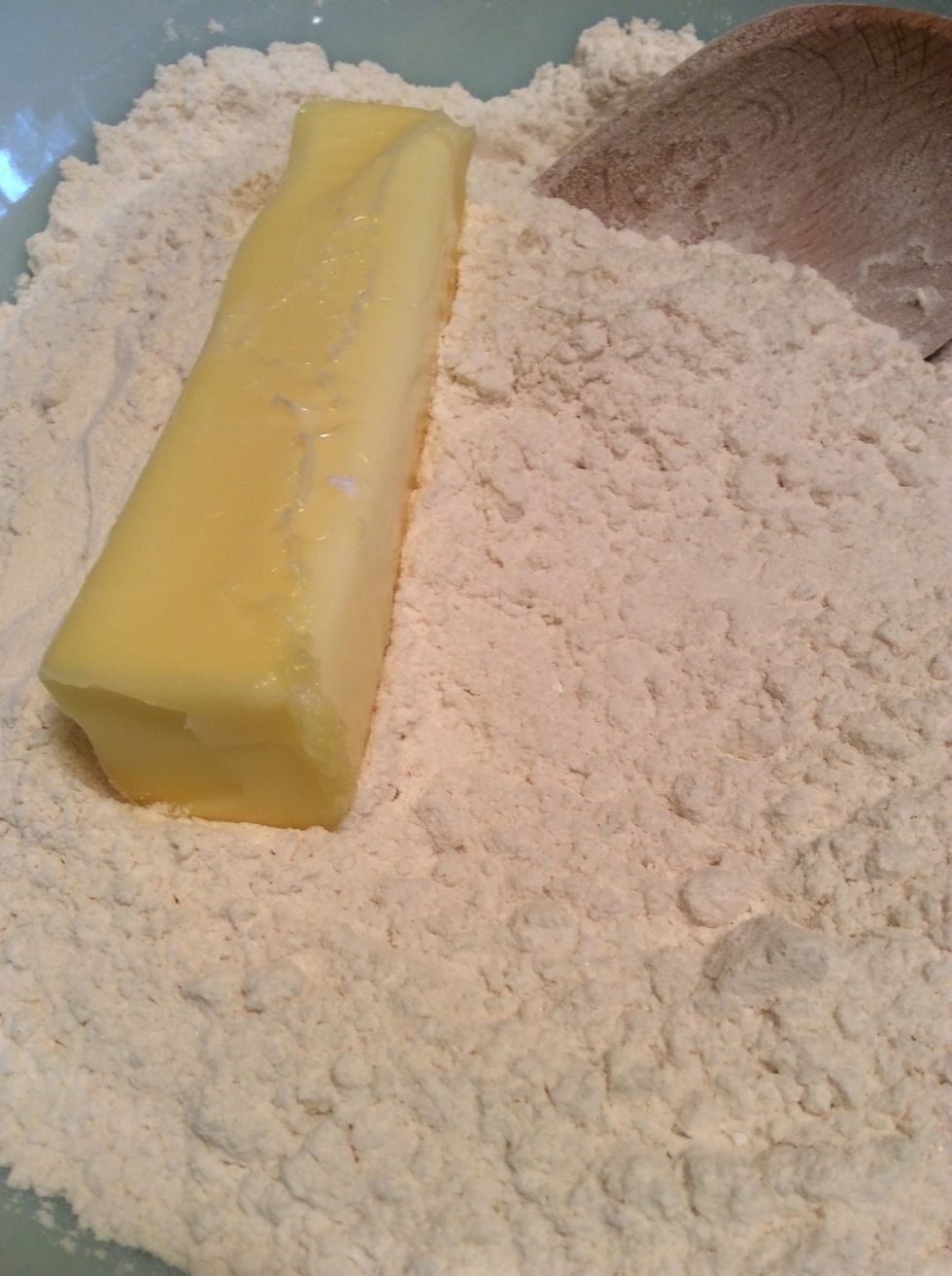 Add soft butter and blend in with hands.