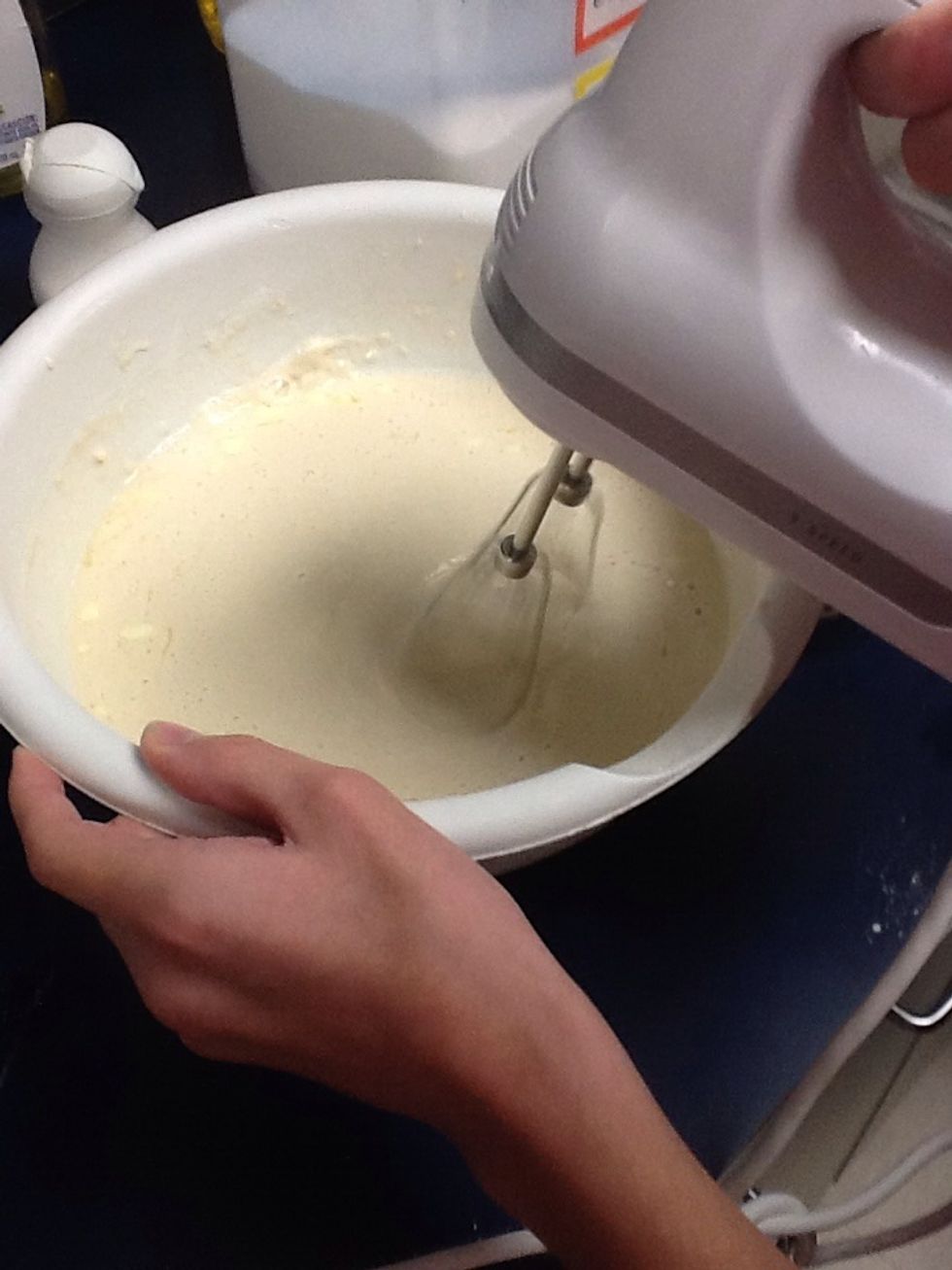 Add softened butter and hot water.