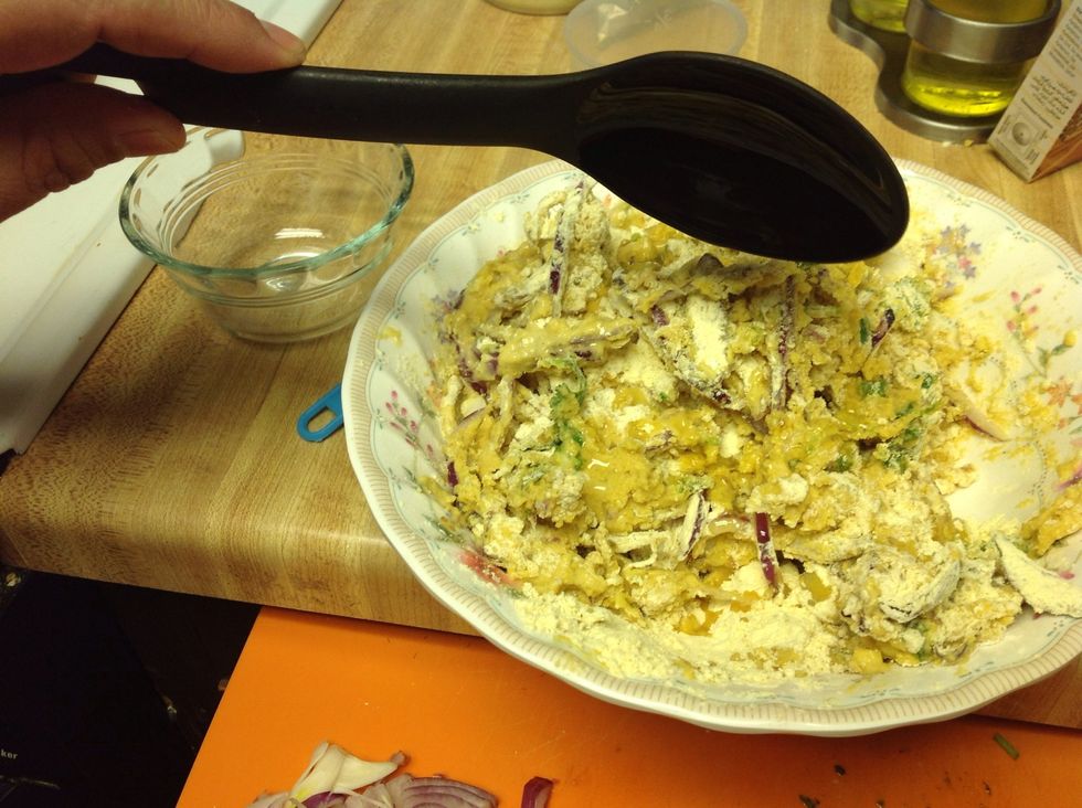 Add some 5 tbsp hot oil and mix again. Be very cautious.