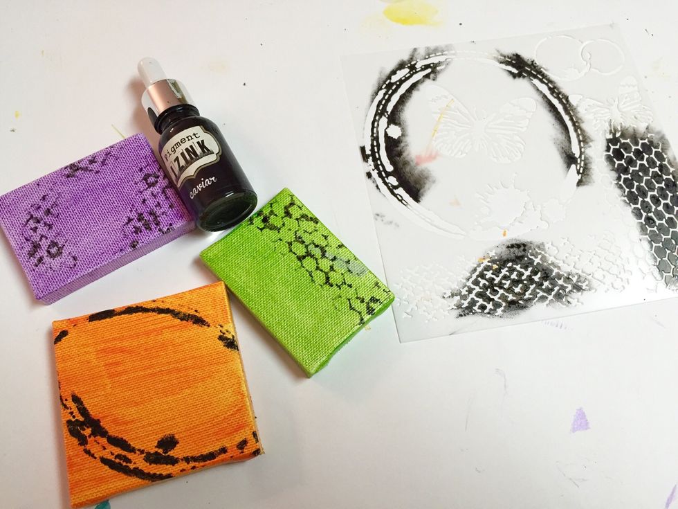 add some background designs to mini canvases using Caviar Izink with the MINI BUTTERFLY COLLAGE stencil; let dry.